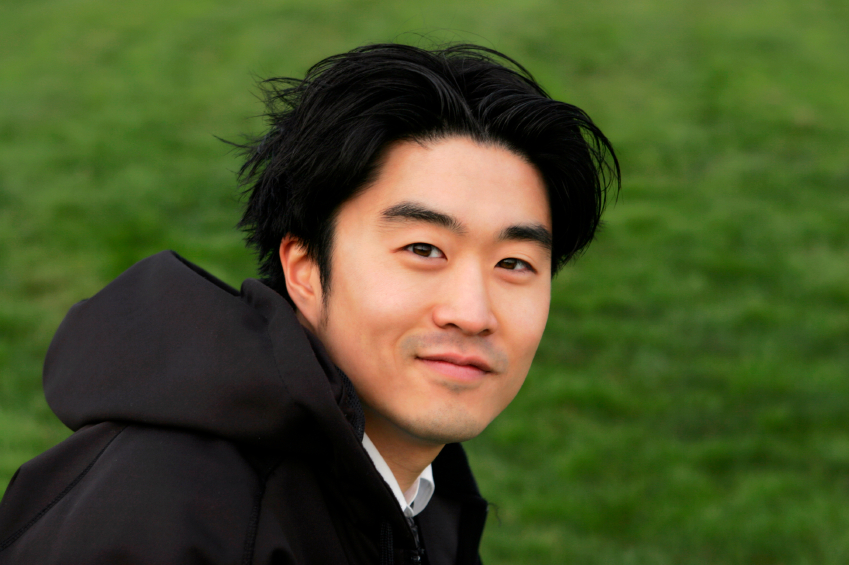 young asian man in hoodie
