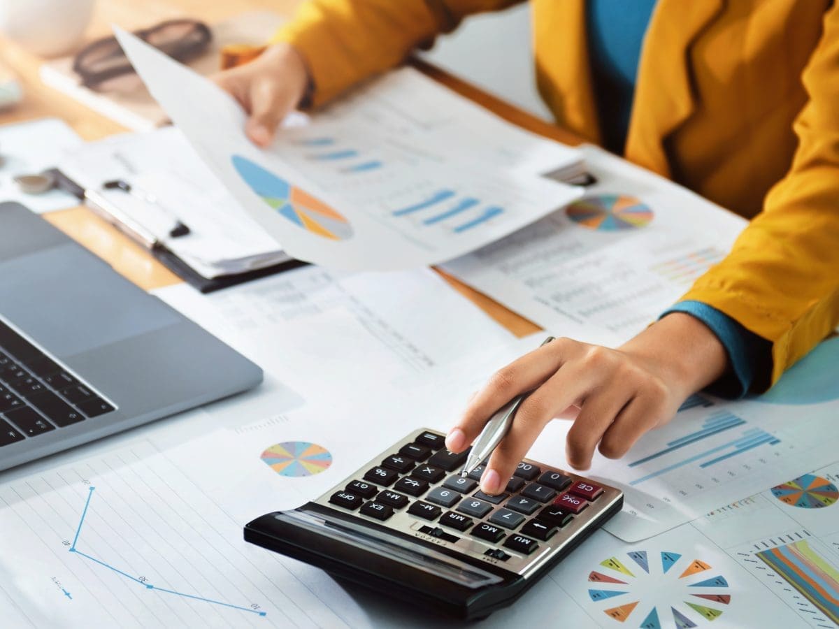 person working on a calculator