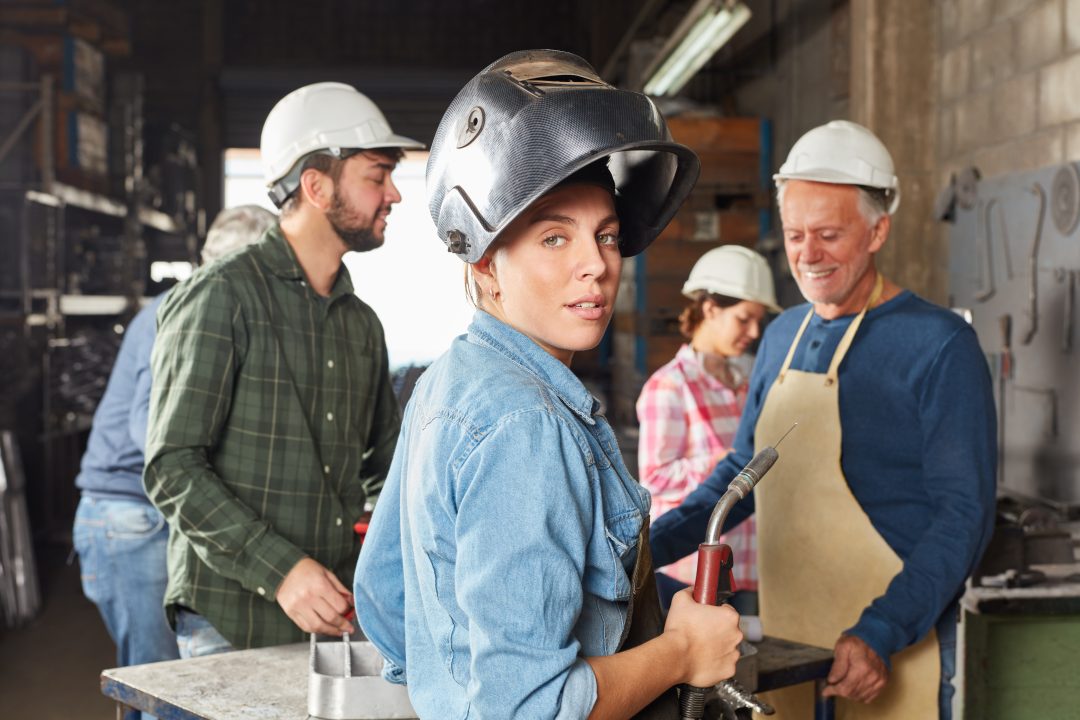 woman tradeswoman looking at camera