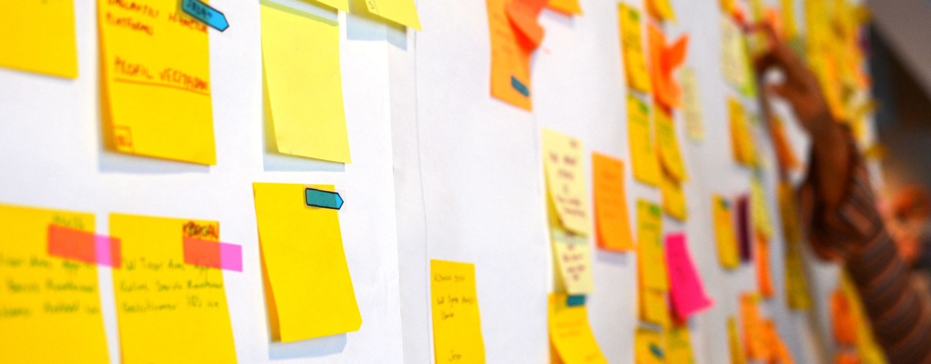 a bunch of sticky notes on a whiteboard